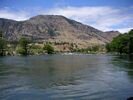 A small rapid in the foreground with Deschutes River country behind