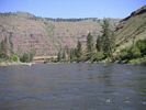 Rafts floating across a glassy section of the Grande Ronde River