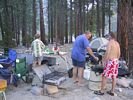 A rafting group preparing a meal at Survey Creek Camp on the Middle Fork of the Salmon