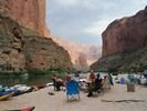 A rafting trip campsite with a spectacular backdrop of the Grand Canyon