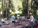 A rafting party gathered around a BBQ on the Middle Fork of the Salmon