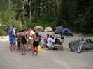 Group gathered around a table at a rafting campsite on the Main Salmon
